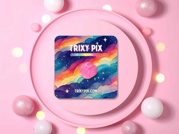 Pink French Fancy pin badge displayed on a pink plate attached to a backing card featuring rainbow-coloured clouds against a pink gradient background.