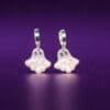Polymer Clay Ghost earrings on a dark purple background