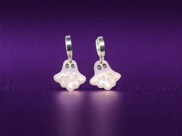 Polymer Clay Ghost earrings on a dark purple background